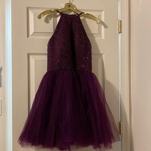 I bought this years ago for my homecoming only wore once not sure the brand.